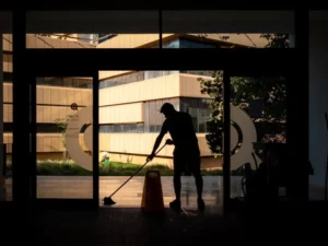 janitorial service provider mopping the floor of a commercial facility
