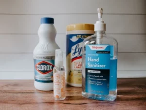 cleaning and sanitization products on a hardwood surface